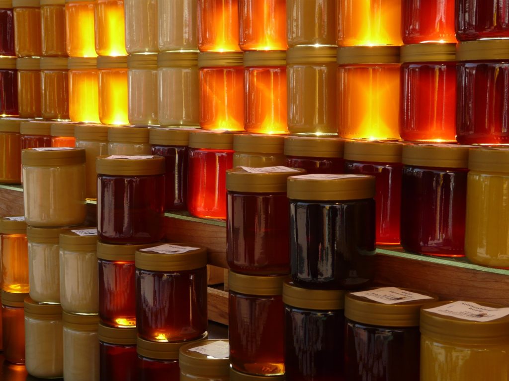 food and beverage - rotten documentary - honey jars stacked honey industry